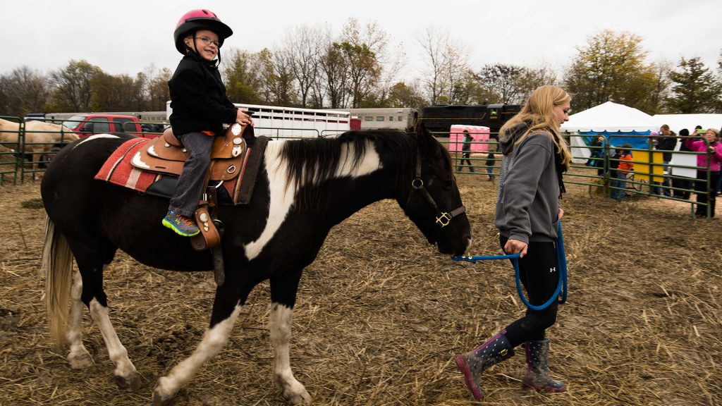 : Pony rides heighten the day's excitement for some of the youngest passengers.