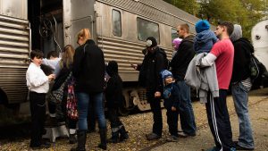 Guests board the Harvest Train in Fishers. ITM volunteers serve as ticket-takers.