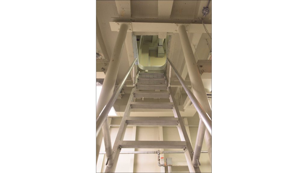 A ladder leads from the floodable room, which resembles the inside of a submarine.