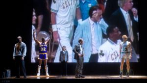 The epic on-court battles between basketball superstars Earvin ''Magic'' Johnson and Larry Bird are dramatized in the play.