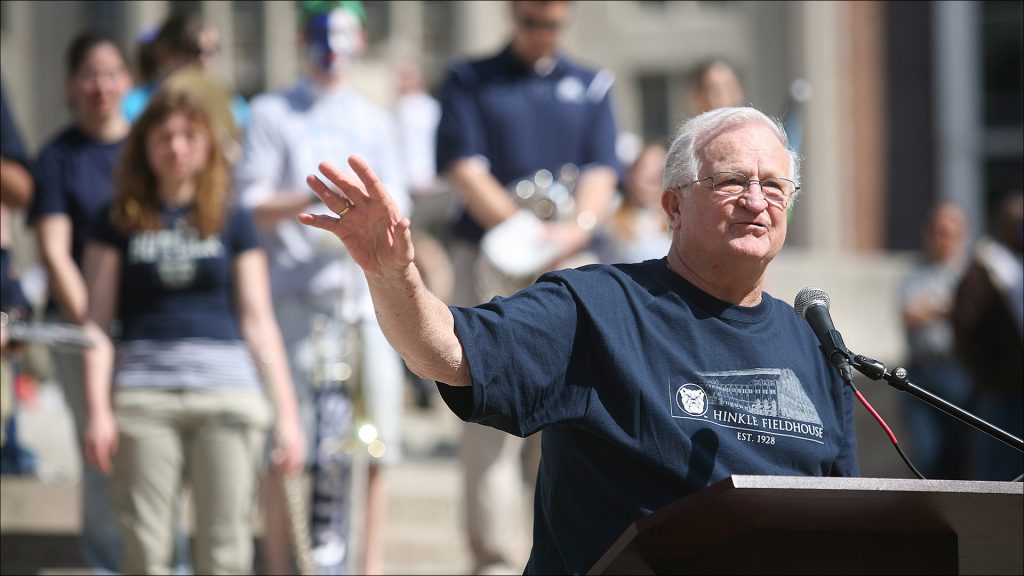 Butler alumnus Bobby Plump takes the podium at Butler pep rally in 2019..