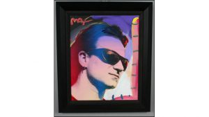 Artist Peter Max painted on a photo of musician Bono-and signed the back ''To Tim Love P. Max 2003.''
