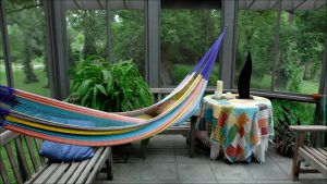 A screened porch is at one end of the second-floor living space.