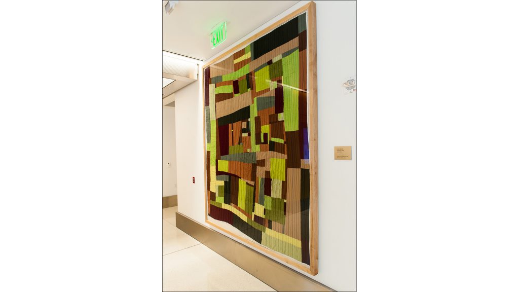 The piece gives a sense of warmth near the maternity-ward elevator bank.