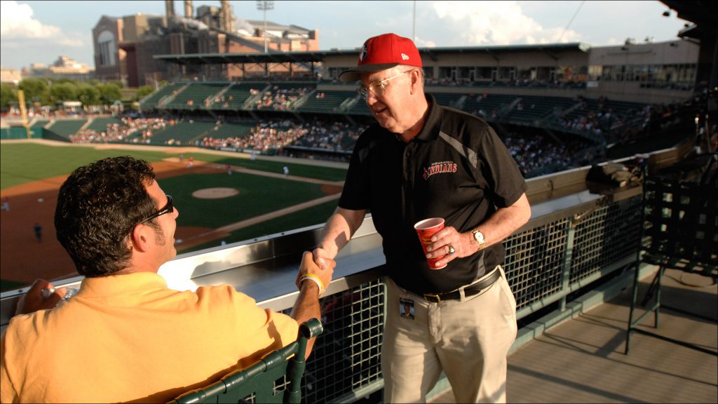 Schumacher greets spectator Pat Cassella of West Haven, Conn., at a recent game.