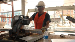 Quein Lapham cuts metal studs for a portion of the JW Marriott lobby.