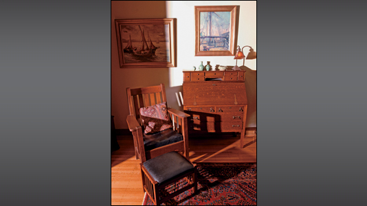 Mission furniture and original artwork dominate the home's decor.