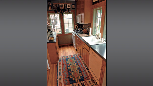 The kitchen is small by today's standards, but is a good fit for the busy family.