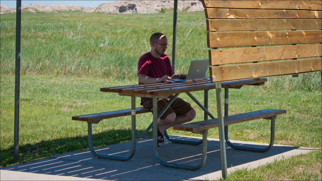 Jon Arnold took advantage of a rest area in The Badlands of South Dakota in late June to catch up on work after using the first week on the road as a vacation.