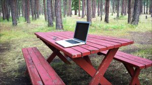 At a Montana RV campground in mid-July, Arnold was struck that his solitary laptop on a picnic table constituted his entire office.