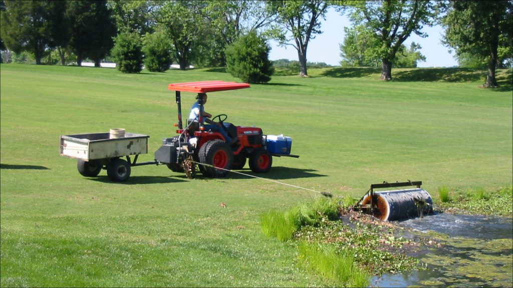 A tractor and a wench are the workhorses that power the disk that scoops up the sunken balls.