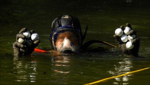 His short dive netted two handfuls of golf balls.