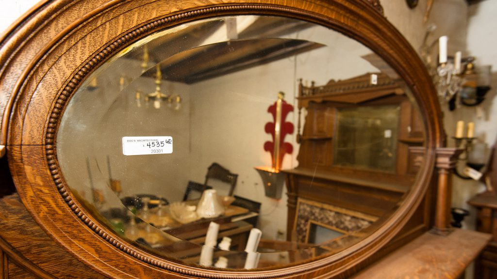 A mirror-topped fireplace surround on display at Doc's
