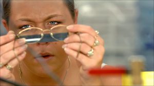 Optician Lacy Crafton puts lenses in frames at Greenwood's LensTech Optical, the largest independently owned optical lab in the state.