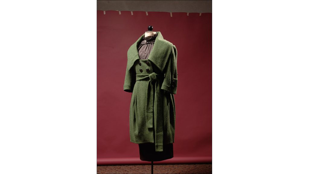 Wool coat in moss green with oversized collar and pewter buttons by Rodriguez, $759, at Frankey's