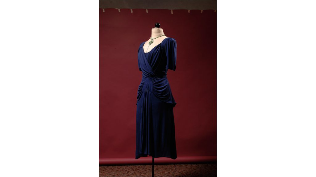 Navy dress in jersey knit with sharp shoulders and curvy seams at the hip by Temperley, $1,175, at Nordstrom at the Fashion Mall