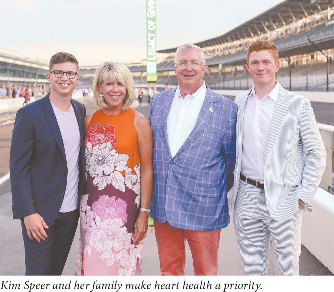 Group photograph of Kim Speer with her husband and two sons.