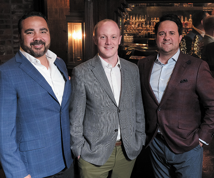 ShipSigma President and co-founder Deyman Doolittle, Chief Revenue Officer Joe Jordan, and CEO and co-founder Chase Flashman pictured at a bar