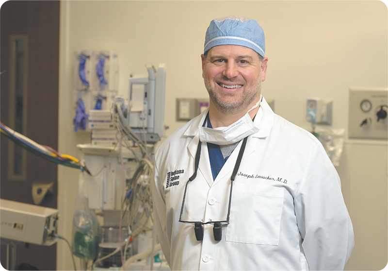 Professional Headshot of Dr. Joseph Smucker in an operating room