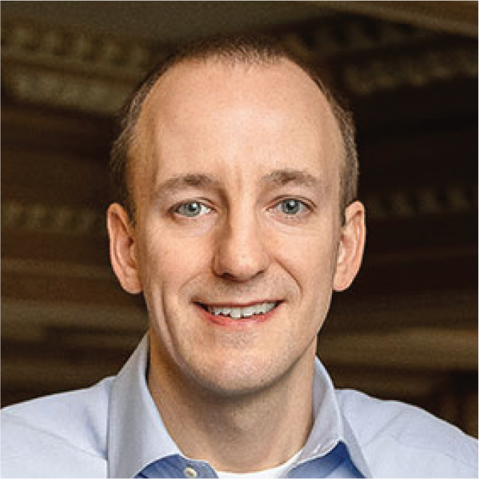 Professional headshot of John Estridge