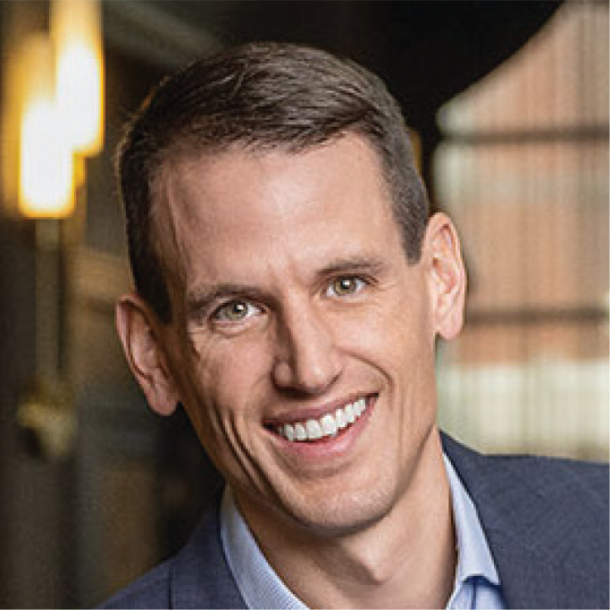 Professional headshot of Tom Askey