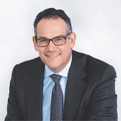 Professional headshot of David E Simon