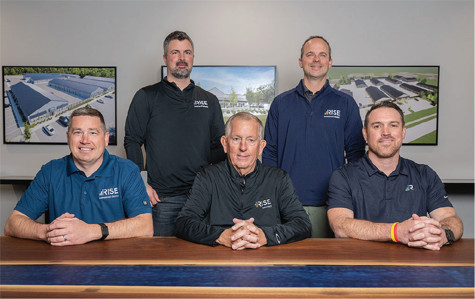 Five members of Rise Commercial District posed at a conference table