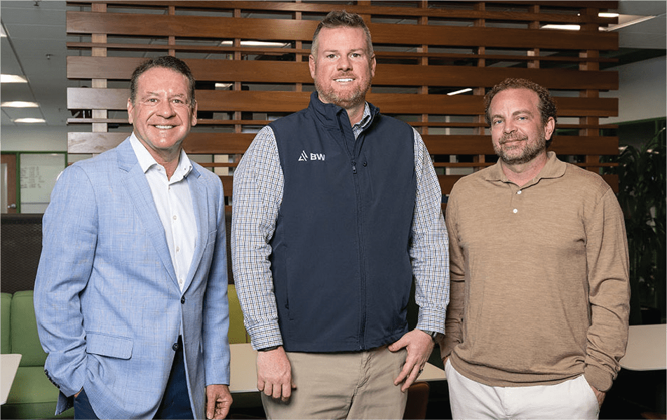 3 members of Build BW LLC posed in their office