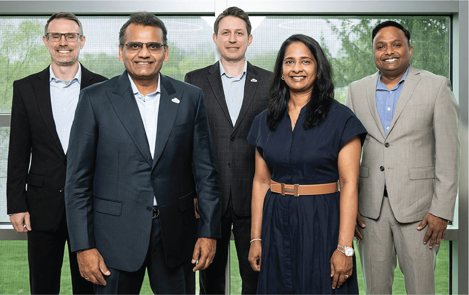 5 members of Brite Systems posed in an office